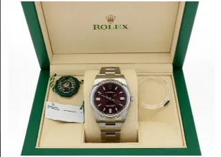 Foto 8 di 8: Rolex ref 116000 red grape dial